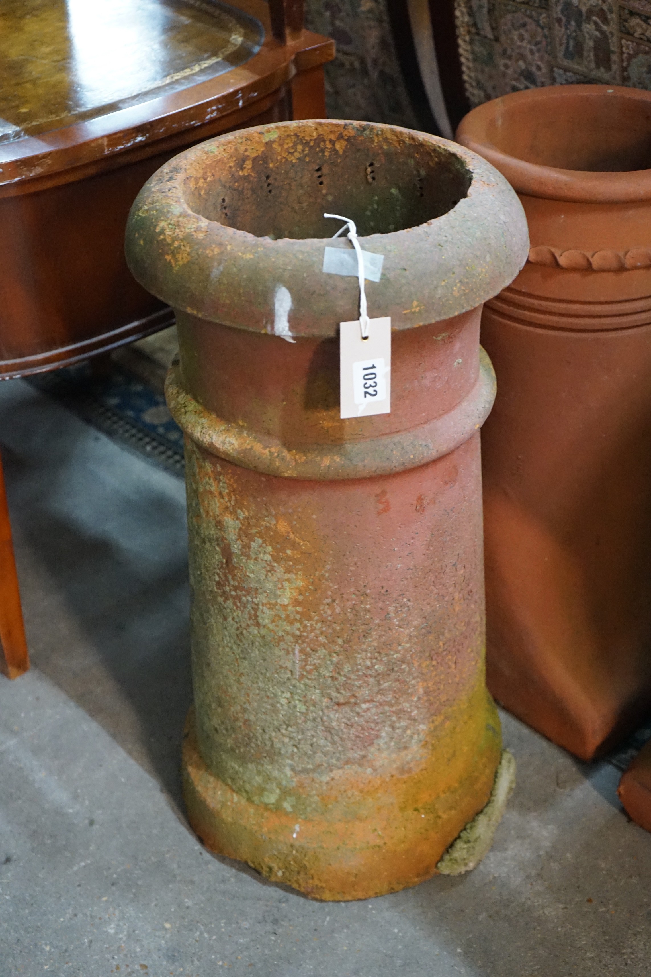 Three terracotta chimney pots, largest height 62cm